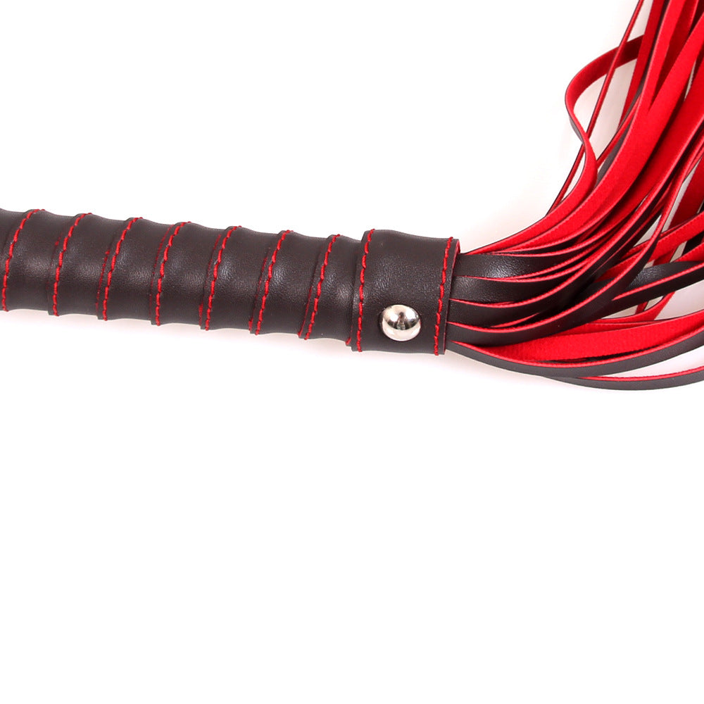 Red and Black Leatherette Flogger with Rivet Detail on the Hand Loop